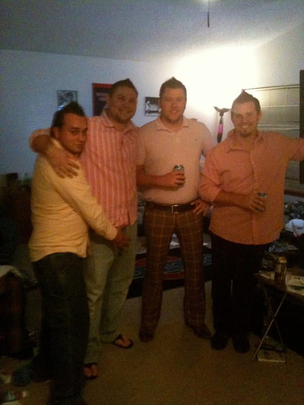 The Todd Place roommates: four guys in matching pink shirts and spiked hair, beers in hand